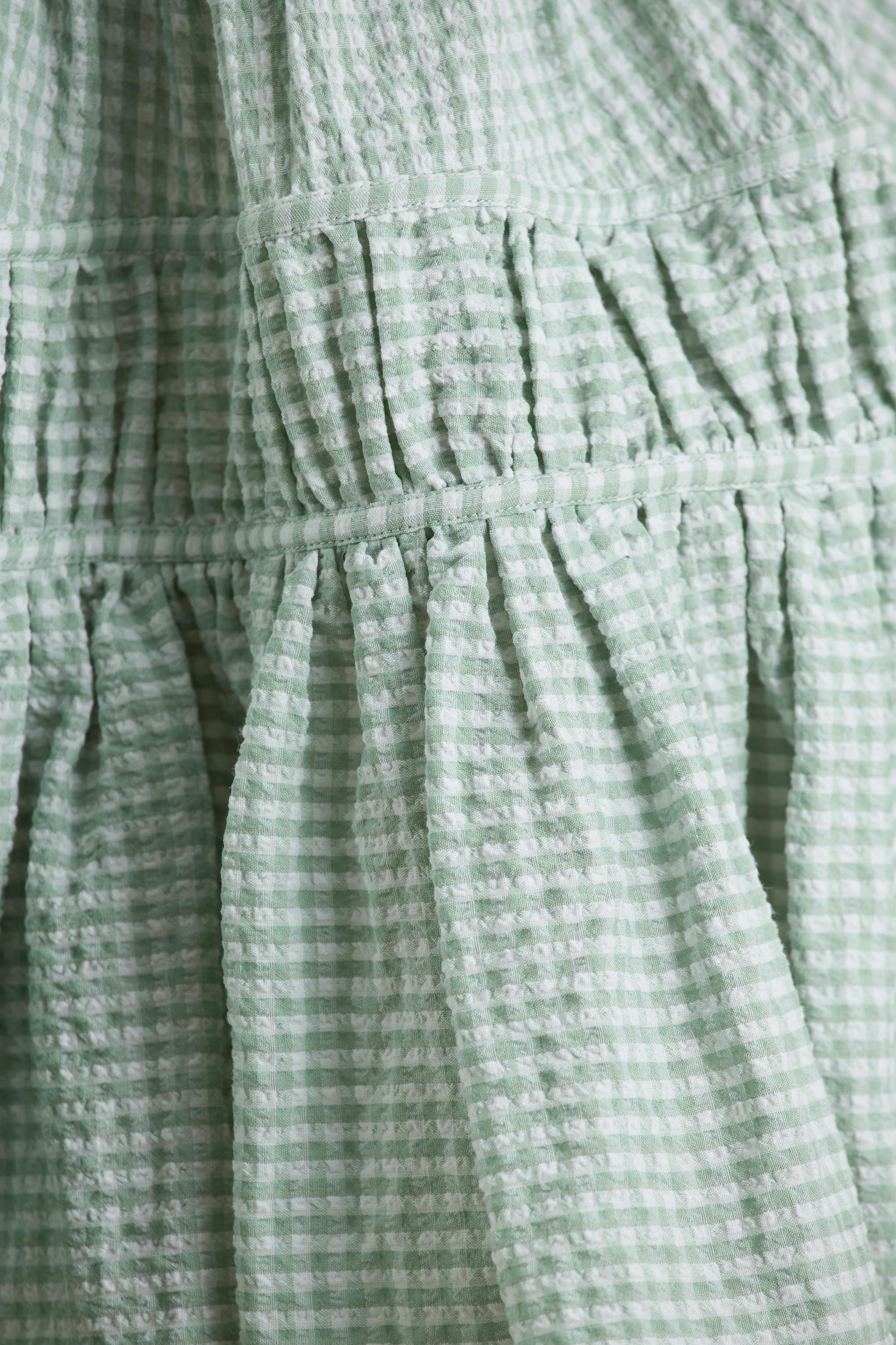 Laurelle | Green Extreme Plunge-Neck Mini Dress With Ruffled Detailing - Image 7