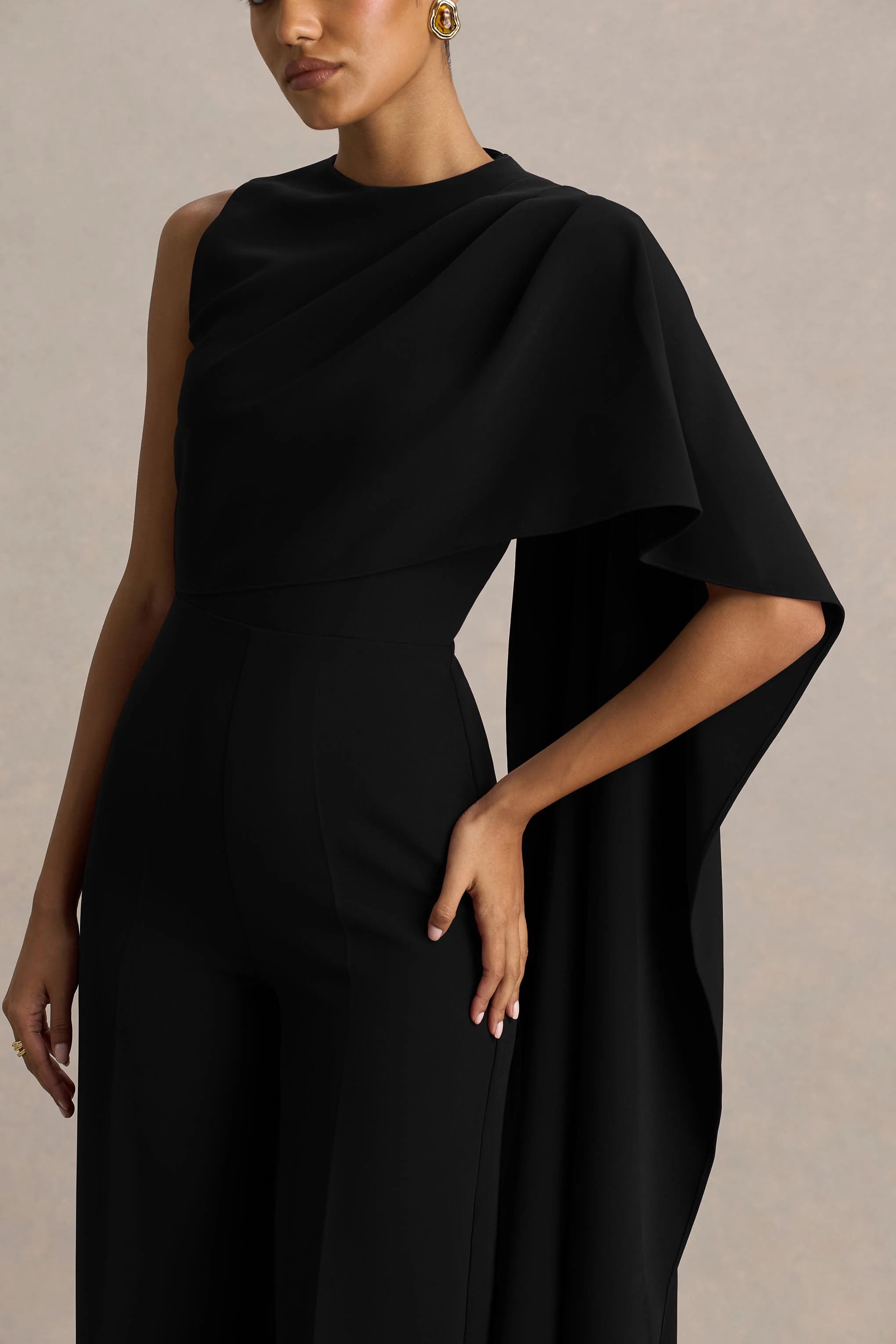 Sorenia | Black High-Neck Jumpsuit With One-Cape Sleeve - Image 7